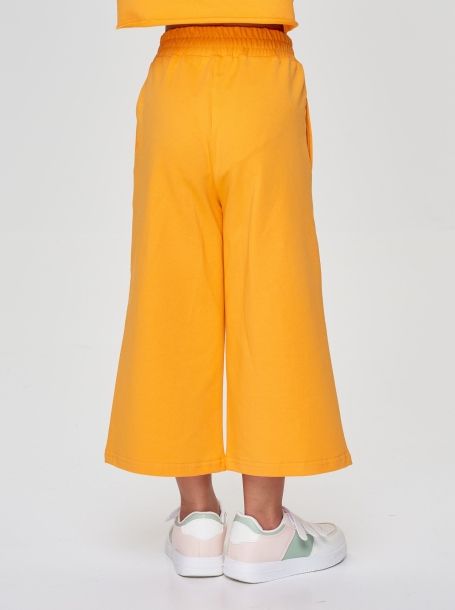 Фото4: Оранжевые брюки-кюлоты из футера